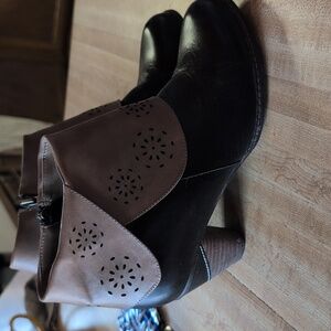 Born leather upper booties in dark brown. Scuff on Left Toe.